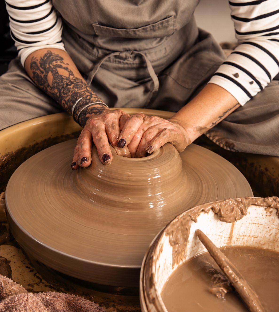 Potter holding a freshly made clay piece