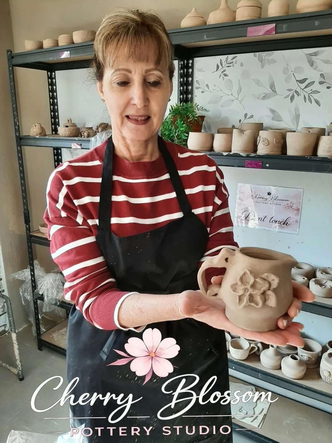 Potter holding a clay creation
